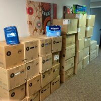 Image contains boxes of adult diapers that have been donated by a parent to AND